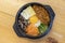 Korean Bibimbap dish with rice and vegetables on wood background