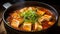 The Korean dish Sundubu jjigae is a thick tofu soup with seafood or meat.