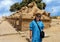 Korean female tourist and Avenue of the Sphinxes from the first pylon of the Karnak Temple in Luxor, Egypt.