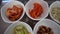 Korean food side dishes Banchan multiple small portions top view angle video kimchi bean sprouts vegetable