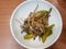 Korean food style, Top view of anchovy stir fried with green pepper, sprinkled.