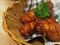 Korean foods. Fried chickens in basket on table.