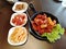 Korean fried chicken with cinnamon sauce and tokbokki