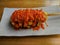 Korean potato corn dog with chili sauce and mayonnaise