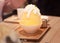 Korean shaved ice or snow cone bingsu, bingsoo dessert with chopped fresh tropical mango fruit, condensed milk, fruit syrup