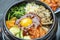 Korean spicy salad with rice traditionally Korean food, Bibimbap mixed rice with meat and assorted vegetables.