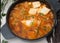 Korean spicy silken tofu stew which is called Sundubu Jjigae.