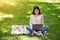 Korean Student Girl Studying Outdoors With Laptop In Park, Sitting On Lawn