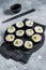 Korean style sushi Kimbap or gimbap made from steamed white rice. Gray background. Top view