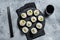 Korean style sushi Kimbap or gimbap made from steamed white rice. Gray background. Top view