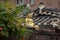 Korean traditional architecture. Golden Buddha statue on a roof