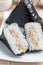 Korean triangle kimbap Samgak with nori, rice and tuna fish, similar to Japanese rice ball onigiri. Vertical