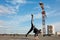 Korean urban style male dancer performing breakdance handstand on top roof