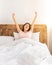 Korean Woman Yawning Waking Up And Stretching Hands At Home