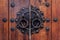 Korean wooden door panels decorated with old black metallic ring handles at a house in ancient village in Jeonju, South Korea