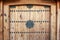 Korean wooden door panels decorated with old black metallic ring handles at a house in ancient village in Jeonju, South Korea