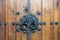 Korean wooden door panels decorated with old black metallic ring handles at a house in ancient village in Jeonju, South Korea