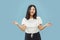 Korean young woman`s half-length portrait on blue background