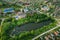 Korma Village, Dobrush District, Belarus. Aerial View Of City Cityscape Skyline With St. John The Korma Convent Church