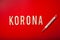 Korona norsk norwegian word text wooden letter on red background corona virus covid-19