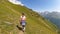 Koruldi Lake Trek -  A hiker on a panoramic hiking path to the Koruldi Lakes, Caucasus, Georgia.