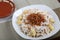 Koshari With Spicy Daqoos riceserved in a dish isolated on table side view of middle east food