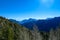 Kosmatitza - Panoramic view of misty Karawanks mountain range on sunny day in Carinthia, Austria