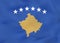 Kosovo waving flag. Kosovo national flag background texture