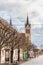 Kossuth Lajos street, main shopping street in old town and Gothic Franciscan parish churchon the background. Keszthely, oldest