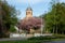 Kostel sv. Anny church of Saint Anne in Havirov at spring with blooming cherry trees