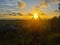 Kota Kinabalu, Sabah Malaysia-29th March 2021. Unidentified woman is posing as if she is holding the sunset.