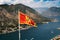 Kotor. Bay of Kotor on the background of the flag of Montenegro. Kotor fortress