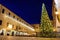 Kotor, Montenegro - December 16, 2021: Large decorated tree on square of Kotor old town on Christmas Eve. Xmas vacations in