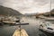 Kotor port with boats, houses and adriatic sea