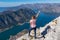 Kotor - Woman with panoramic view from Derinski Vrh of Kotor bay in sunny summer, Adriatic Mediterranean Sea, Montenegro