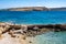 Koufonisia island, Cyclades, Greece. Rocky beach, Aegean Sea sunny day clear blue sky background