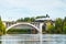 Kouvola, Finland - 18 September 2020: Autumn landscape of bridge with moving old steam passenger train Ukko-Pekka and Kymijoki