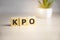 KPO - Knowledge Process Outsourcing, acronym business concept on wooden cubes