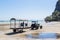 Krabi Province, Thailand - May 12, 2019: A special tractor with a passenger trailer delivers tourists and luggage to the shore