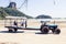 Krabi Province, Thailand - May 12, 2019: A special tractor with a passenger trailer delivers tourists and luggage to the shore