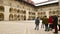 Krakow, Poland - 6th march, 2023: guide with tour group in in Krakow Wawel Royal castle yard. Free tourist walking tours with