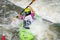 Krakow, Poland - August 27th, 2022: Canoeist struggling with the power of rushing current in whitewater canoening track in Krakow