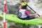 Krakow, Poland - August 27th, 2022: Canoeist struggling with the power of rushing current in whitewater canoening track in Krakow