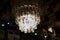 Krakow, Poland - July 18, 2020: A hanging ceiling lamp made of empty desperado beer bottle inside a restaurant