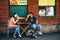 KRAKOW, POLAND - JUNE 26, 2015: Couple, seller and polish fastfood - zapekanka on Nowy Square