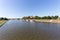 KRAKOW, POLAND - JUNE 9, 2018. Tourists in Motor boats Restaurants on Vistula River near Wawel Castle in Krakow