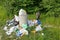 Krakow, Poland - June 9, 2019 Wild boar eats garbage near a pile of garbage in the forest