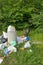 Krakow, Poland - June 9, 2019 Wild boar eats garbage near a pile of garbage in the forest