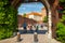 KRAKOW, POLAND - MAY 16, 2015: Tourists passing through Bernardine Gate as main entry to historical complex of Wawel Royal Castle