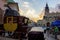 Krakow, Poland: Medieval public postal service through horse carriage parked against polish architecture during